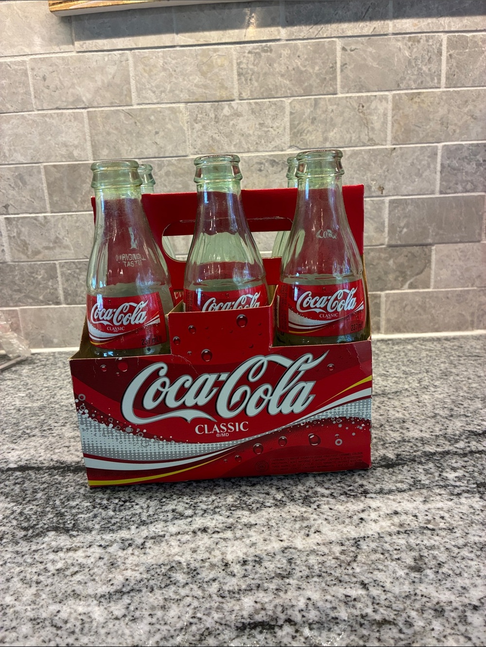 Vintage red and clear coca-cola glass bottles with carrier B33